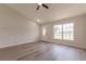 Inviting living room featuring new floors, ample natural light, and a ceiling fan for a comfortable feel at 1856 Laredo Dr, Deltona, FL 32738
