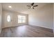 Open living room space featuring new floors, ample natural light, and a modern ceiling fan at 1856 Laredo Dr, Deltona, FL 32738