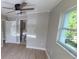 Cozy bedroom featuring a ceiling fan and a view from a bright window at 2506 Bonneville Dr, Orlando, FL 32826