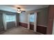Carpeted bedroom with windows and accents at 2506 Bonneville Dr, Orlando, FL 32826