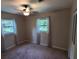 Well-lit bedroom featuring two large windows and standard closet doors at 2506 Bonneville Dr, Orlando, FL 32826