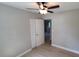 The bedroom features wood floors, a ceiling fan, and standard closet doors at 2506 Bonneville Dr, Orlando, FL 32826