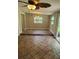 Spacious dining room with brick floors, two windows, a chandelier, and sliding door to the outside at 2506 Bonneville Dr, Orlando, FL 32826