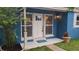 Inviting front entrance with a freshly painted door, decorative light fixture, and neat landscaping at 2506 Bonneville Dr, Orlando, FL 32826
