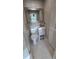 Cozy half-bathroom featuring a classic white toilet and sink combo, perfect for guests at 2506 Bonneville Dr, Orlando, FL 32826