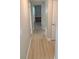 Bright hallway with laminate flooring, connecting various rooms in the home for easy access at 2506 Bonneville Dr, Orlando, FL 32826