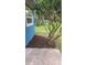A tree with mulch and shrubbery, adding natural beauty to the side of the building at 2506 Bonneville Dr, Orlando, FL 32826