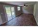 Open living area with decorative flooring, sliding glass doors, and access to outdoor space at 2506 Bonneville Dr, Orlando, FL 32826
