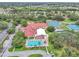 Overhead view of community recreation facilities, including pool and tennis courts at 5402 Rosewall Cir, Leesburg, FL 34748