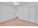 Comfortable bedroom with carpet flooring, a ceiling fan, and closet, perfect for relaxation at 5402 Rosewall Cir, Leesburg, FL 34748