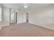 Bedroom featuring neutral carpet and views of the bathroom and hallways at 5402 Rosewall Cir, Leesburg, FL 34748