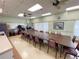 Multi-purpose room with long conference table and chairs, perfect for community meetings at 5402 Rosewall Cir, Leesburg, FL 34748