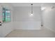 Cozy dining area features a white door to backyard and tile floors, perfect for casual meals at 5402 Rosewall Cir, Leesburg, FL 34748