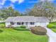Attractive single-story home boasting beautiful landscaping and a well-kept front lawn at 5402 Rosewall Cir, Leesburg, FL 34748