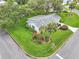 Lush landscaping surrounds this well-maintained home with a charming curb appeal on a corner lot at 5402 Rosewall Cir, Leesburg, FL 34748