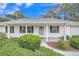 Inviting front exterior with well-maintained landscaping and a covered porch at 5402 Rosewall Cir, Leesburg, FL 34748