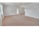 Spacious living room with neutral carpet, ceiling fan and ample natural light at 5402 Rosewall Cir, Leesburg, FL 34748