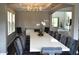 Open-concept dining room featuring modern decor, a large table for entertaining, and lots of natural light at 1319 Heavenly Cv, Winter Park, FL 32792