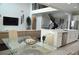 View of a large open-concept living space, kitchen, and stairs to a second floor at 1319 Heavenly Cv, Winter Park, FL 32792