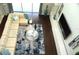 Bright living room with hardwood floors, a plush sectional, and large windows at 1319 Heavenly Cv, Winter Park, FL 32792