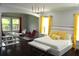 Stylish Primary bedroom with a seating area, dark wood floors, and ample natural light at 1319 Heavenly Cv, Winter Park, FL 32792