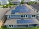 Aerial view of a home with solar panels installed on the roof at 1319 Heavenly Cv, Winter Park, FL 32792