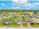 Community aerial view with manicured lawns, with lake in the background at 2053 Charleston Ln, Bartow, FL 33830