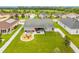 Aerial view of backyard featuring a fire pit, patio seating, and spacious fenced-in yard at 2053 Charleston Ln, Bartow, FL 33830