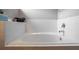 Bright, white tiled bathtub with chrome fixtures offers a peaceful retreat at 2053 Charleston Ln, Bartow, FL 33830