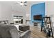 Comfortable living room with a sliding glass doors, plush seating, and wood flooring at 2053 Charleston Ln, Bartow, FL 33830