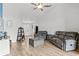 Spacious living room with hardwood floors, plush seating, and a bright, airy atmosphere at 2053 Charleston Ln, Bartow, FL 33830