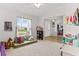 Spacious playroom with carpeted floors, natural light, and plenty of space to play at 2053 Charleston Ln, Bartow, FL 33830