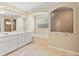 Bright bathroom featuring a double vanity, garden tub, and walk-in shower at 2645 Sw 148Th Ln, Ocala, FL 34473