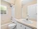 Bright bathroom featuring a white vanity and a tub with a showerhead at 2645 Sw 148Th Ln, Ocala, FL 34473