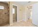 Bathroom with a walk-in tiled shower, toilet, and hallway entrances at 2645 Sw 148Th Ln, Ocala, FL 34473
