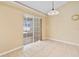 Bright dining area features sliding glass doors, tile floors, and modern pendant lighting at 2645 Sw 148Th Ln, Ocala, FL 34473