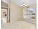 Airy dining area featuring neutral colors, tile flooring, and a large window at 2645 Sw 148Th Ln, Ocala, FL 34473