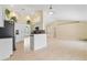 Open concept kitchen with stainless steel appliances and arched doorways to living area at 2645 Sw 148Th Ln, Ocala, FL 34473