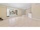 Bright living room with tile floors and a view of the lanai and pool at 2645 Sw 148Th Ln, Ocala, FL 34473