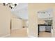 Bright and spacious living room with tile floors, high ceilings, and view into the kitchen at 2645 Sw 148Th Ln, Ocala, FL 34473