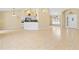 Bright, open living room with tile floors and views into the kitchen and entryway at 2645 Sw 148Th Ln, Ocala, FL 34473