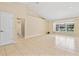 A spacious living room with bright lighting and a view of the lanai at 2645 Sw 148Th Ln, Ocala, FL 34473