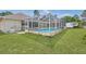 In-ground pool with enclosure in the backyard at 2645 Sw 148Th Ln, Ocala, FL 34473