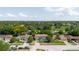 Aerial view showcasing a home and its position in a well-established neighborhood, near a green space and roads at 7072 Scruboak Ln, Orlando, FL 32818