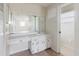 This bathroom features a single sink vanity and a mirror with Hollywood-style lighting at 7072 Scruboak Ln, Orlando, FL 32818
