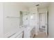 This bathroom features a single sink vanity and a mirror with Hollywood-style lighting at 7072 Scruboak Ln, Orlando, FL 32818
