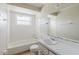 This bathroom features a tub-shower combo, tile flooring, and single sink vanity at 7072 Scruboak Ln, Orlando, FL 32818