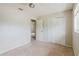 This bedroom features neutral walls, carpeted floors, a closet, and natural light from a window at 7072 Scruboak Ln, Orlando, FL 32818