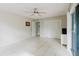 Airy bedroom with tile flooring, closet, and view to the outside at 7072 Scruboak Ln, Orlando, FL 32818
