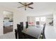 Dining area with dark wood table and a view into the kitchen at 7072 Scruboak Ln, Orlando, FL 32818